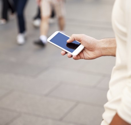 Person holding mobile phone