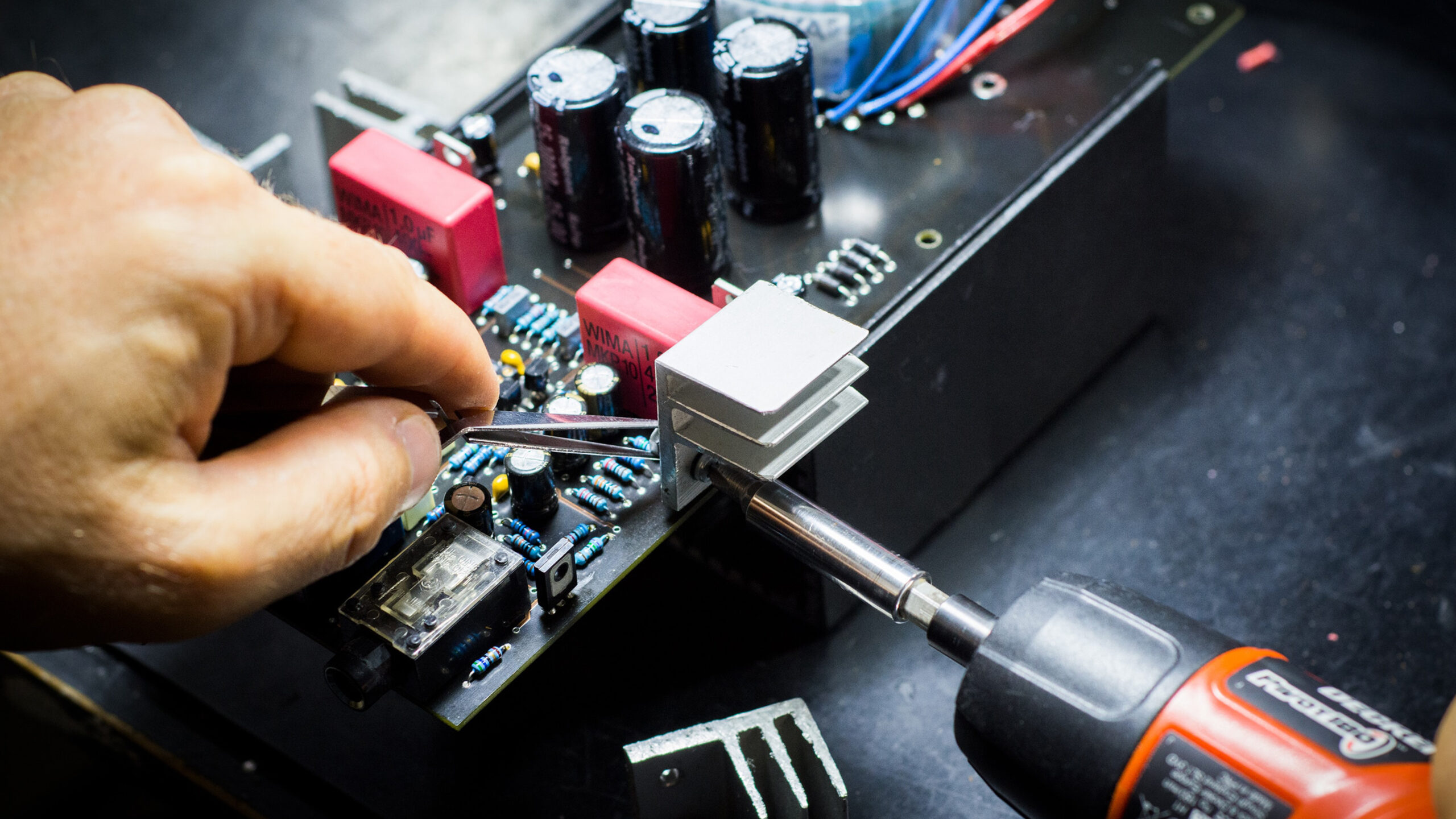 Human working with circuit board