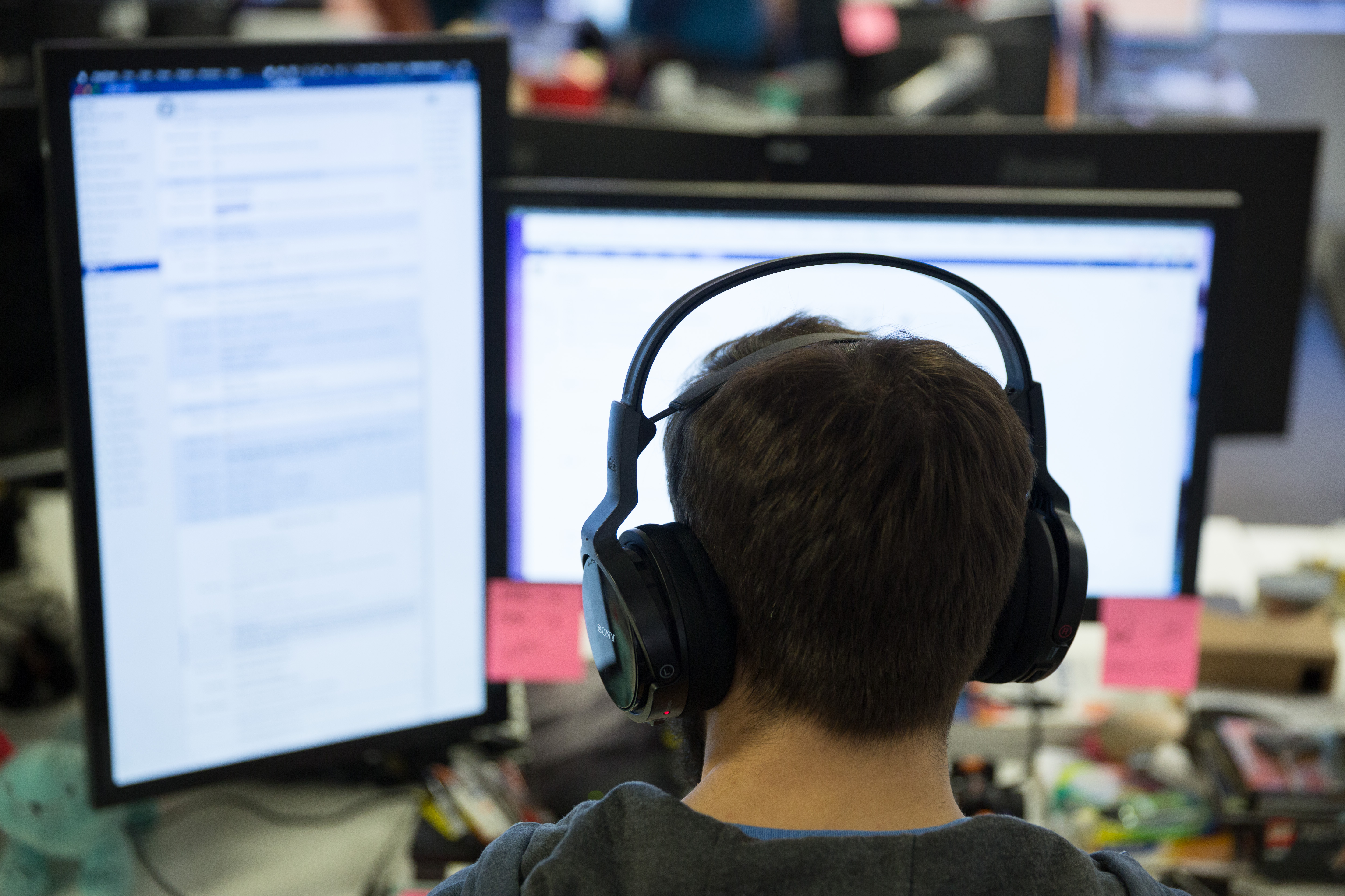 Developer working at two screens