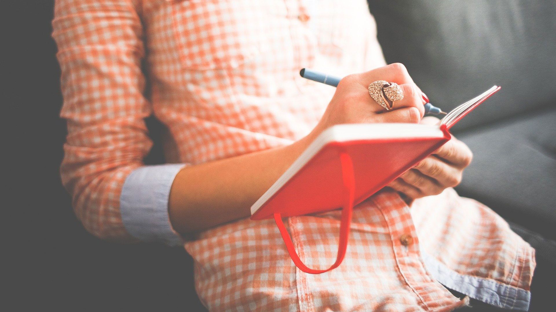 Person writing in a diary