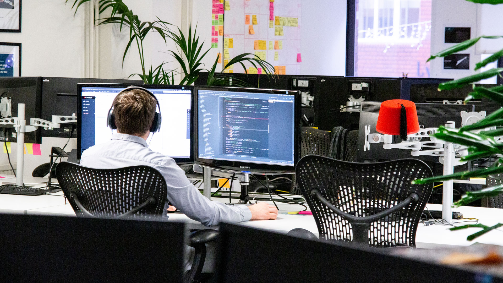 Person working at a computer, shot from behind