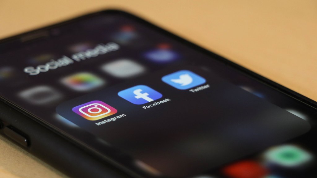 Smartphone showing Instagram, Facebook and Twitter apps