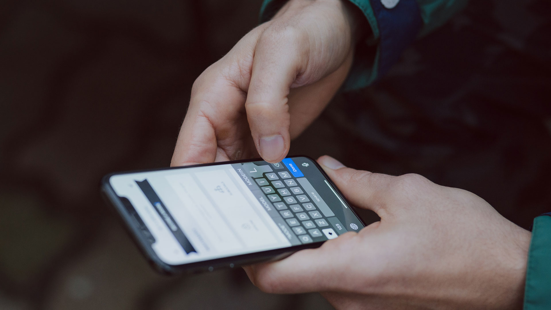 Person's hands using a smartphone