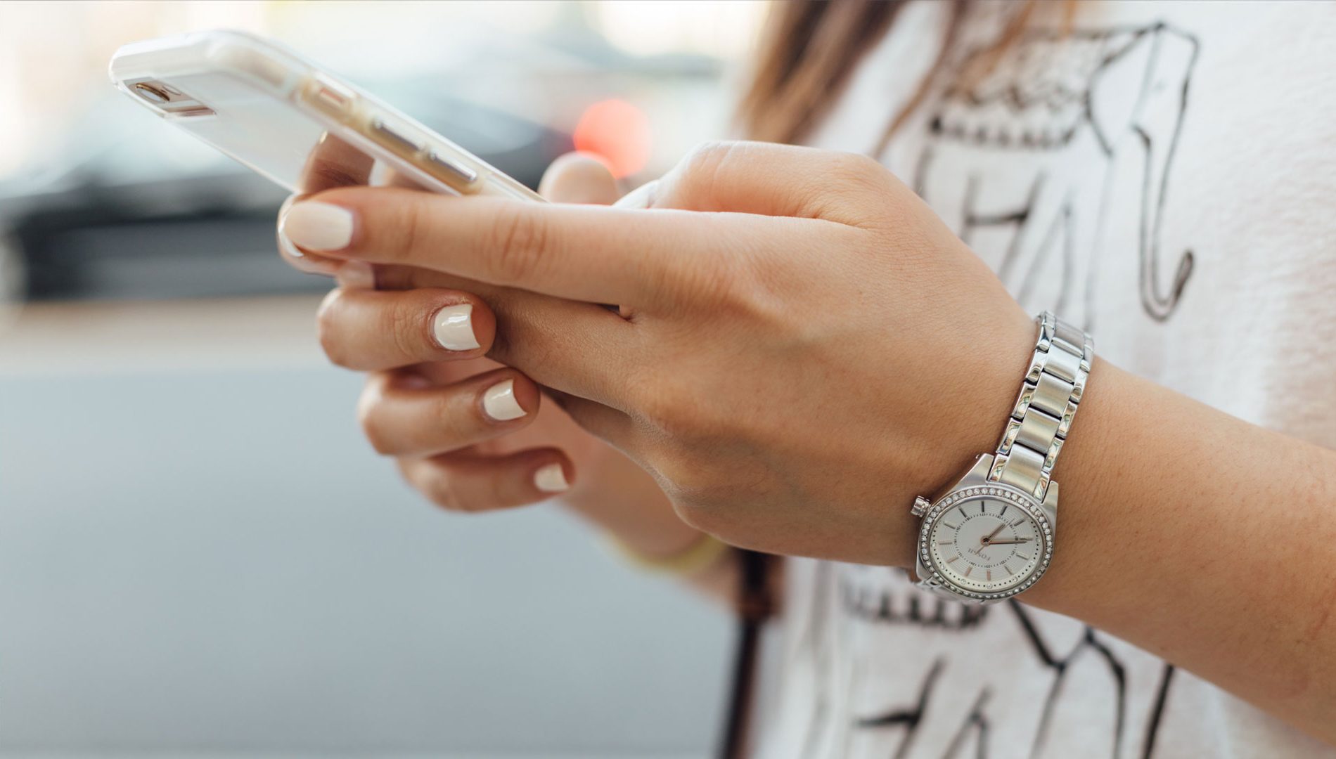 Close up of person's hands using smartphone