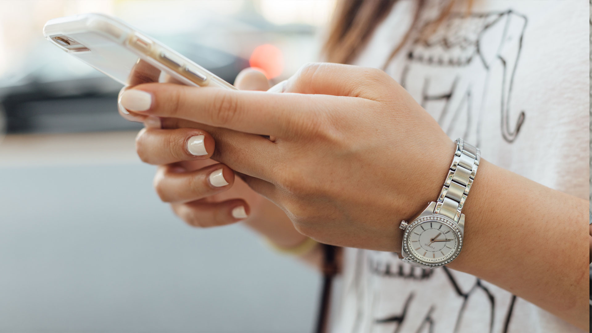 Close up of person's hands using smartphone