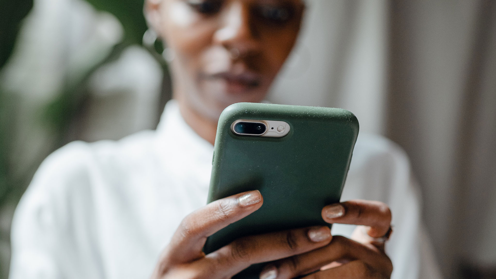 Close up of a smartphone being held by a woman