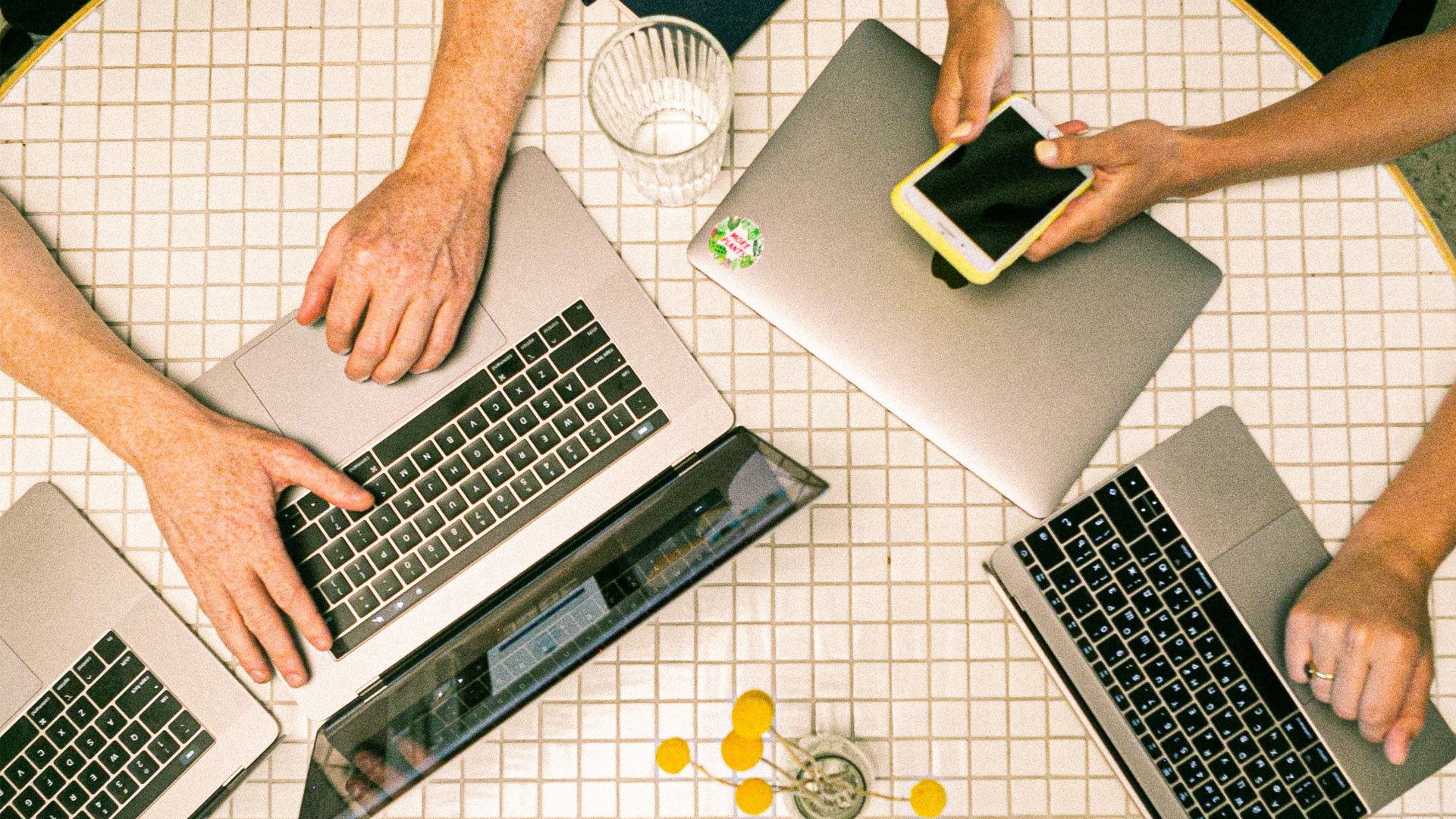 Multiple laptops on a tiled table