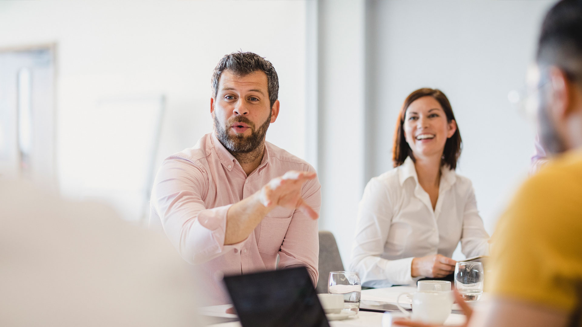 Group of people having a discussion at a table