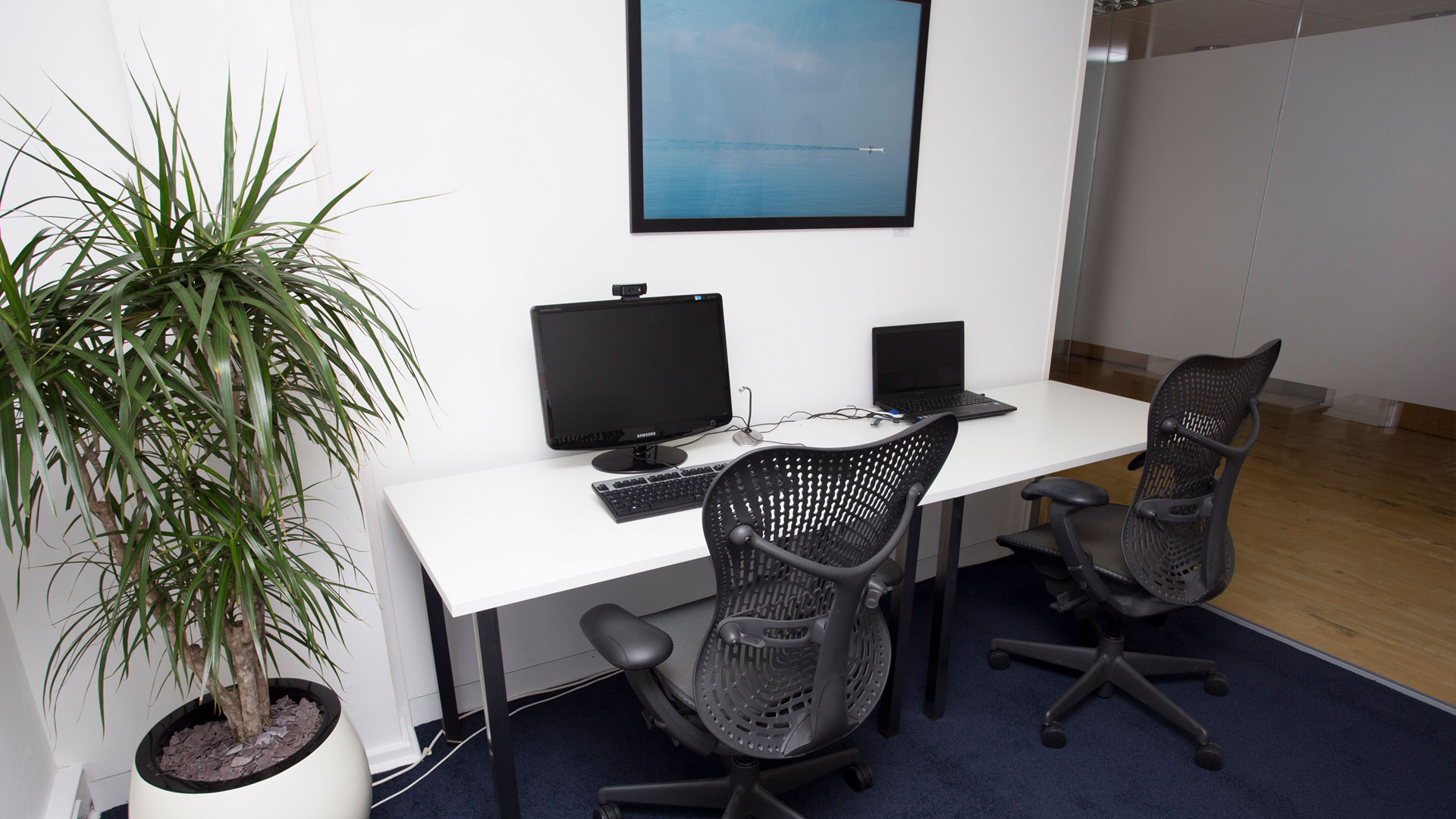 Usability testing lab with desktop and laptop devices set up